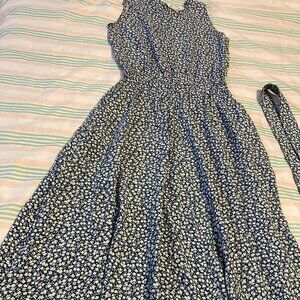 Vintage Erica women's sleeveless blue floral print dress.